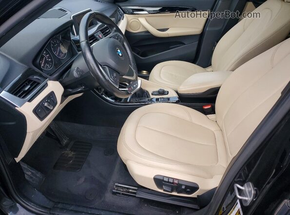 WBXHT3Z3XG4A48199 2016 BMW X1 Black Front interior view