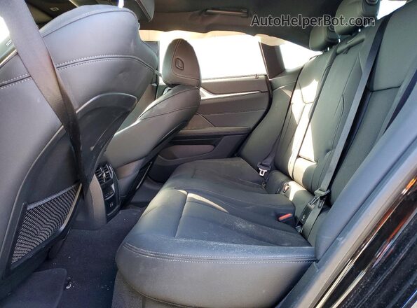 WBY43AW02RFS33974 2024 BMW I4 Black Rear seats view