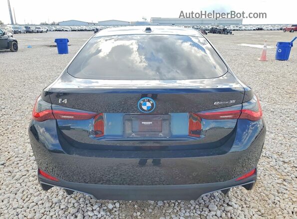 WBY43AW06PFP47016 2023 BMW I4 Black Widok z tyłu