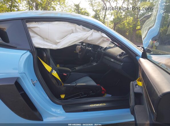 WP0AE2A85PS280695 2023 PORSCHE CAYMAN Синий Вид салона спереди