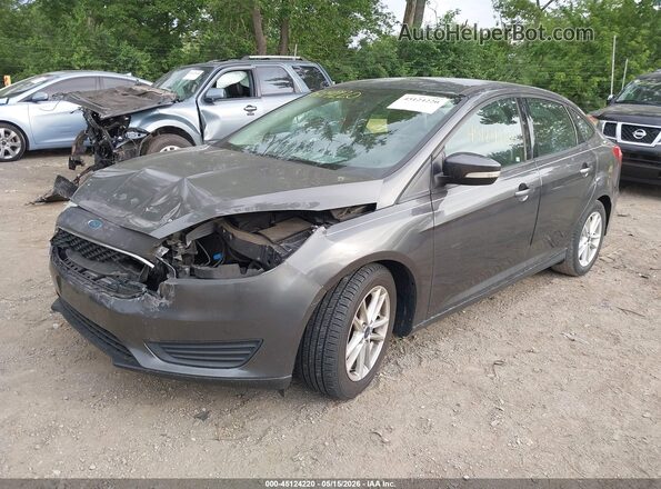 1FADP3F21GL335404 2016 FORD FOCUS Gray Vista tres cuartos delantera izquierda