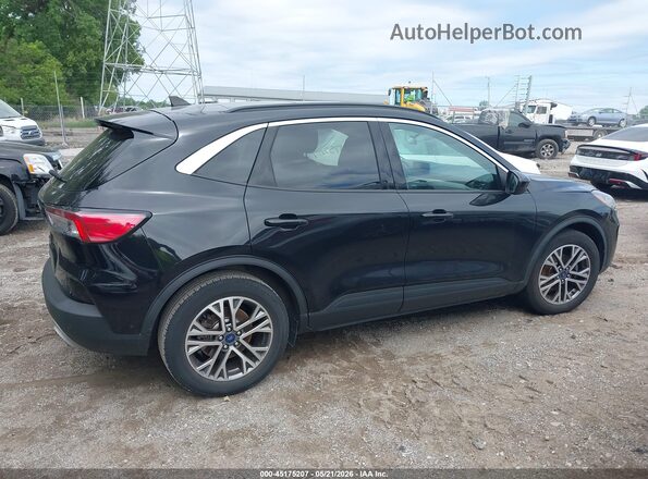1FMCU0H65MUA28302 2021 FORD ESCAPE Black Вид задньої частини салону