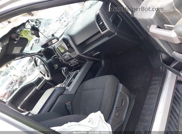 1FTEW1E58KFC00123 2019 FORD F150 Серебряный Вид салона спереди