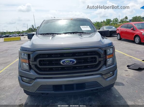 1FTEW1EP6PKF06186 2023 FORD F150 Gray Widok wnętrza z tyłu