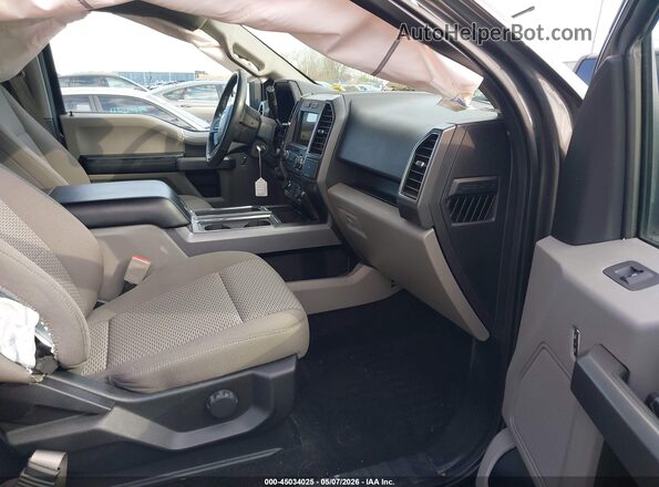 1FTFW1E52JFD18588 2018 FORD F150 Gray Vista interior delantera