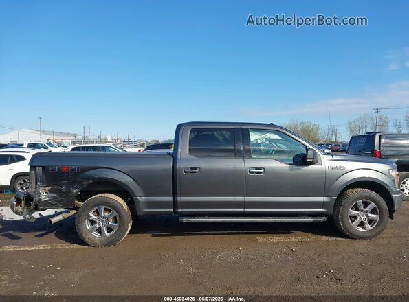 1FTFW1E52JFD18588 2018 FORD F150 Gray Vista interior trasera