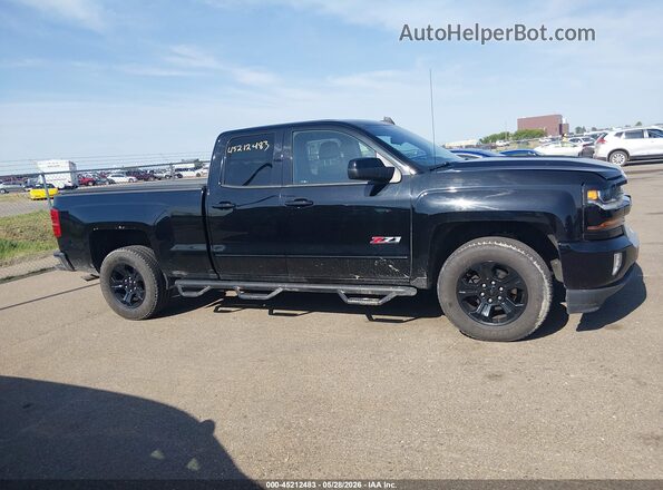 1GCVKREC0HZ190400 2017 CHEVROLET SILVERADO Black Rear interior view