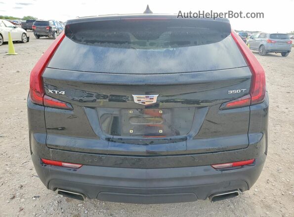 1GYAZAR49MF049975 2021 CADILLAC XT4 Black Rear view