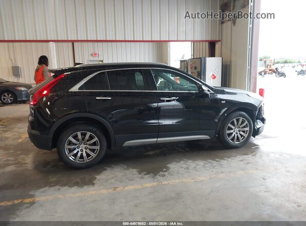 1GYFZCR49KF149122 2019 CADILLAC XT4 Black Vista interior trasera