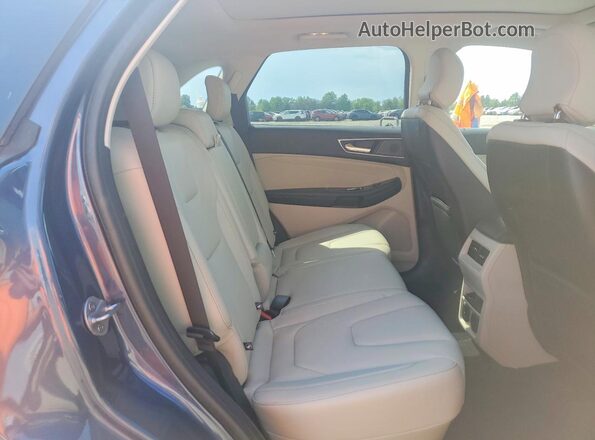 2FMPK3K98KBC16343 2019 FORD EDGE Blue Vista interior trasera