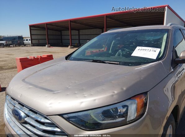2FMPK4J97LBA49725 2020 FORD EDGE Золотой Вид спереди