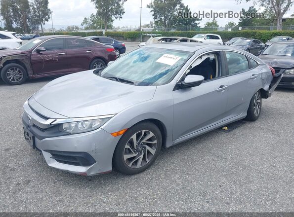 2HGFC2F79JH504921 2018 HONDA CIVIC Silver Front left