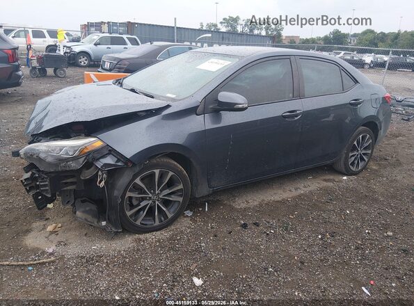 2T1BURHE4HC762301 2017 TOYOTA COROLLA Dark Blue Vista tres cuartos delantera izquierda