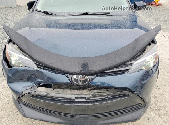 2T1BURHE4JC975979 2018 TOYOTA COROLLA Blue Rear interior view