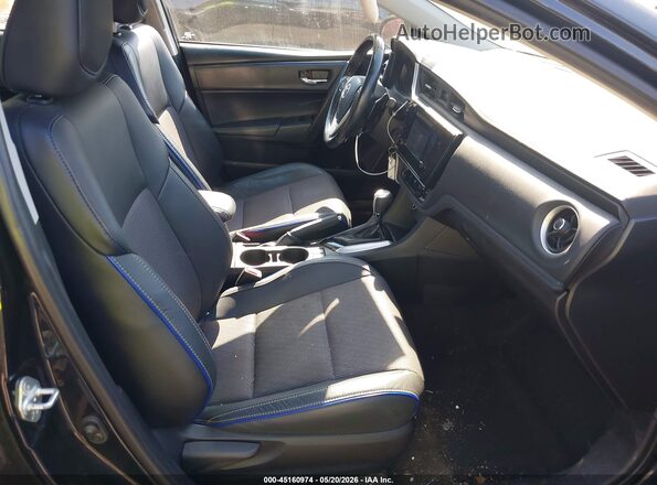 2T1BURHE4KC186328 2019 TOYOTA COROLLA Black Front interior view
