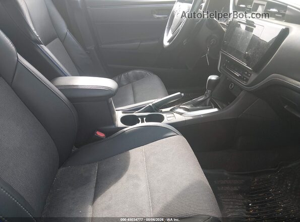 2T1BURHE5JC003887 2018 TOYOTA LL Black წინა სალონის ხედი