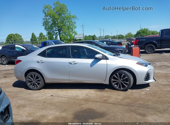 2T1BURHEXHC867084 2017 TOYOTA COROLLA Silver Vista interior trasera