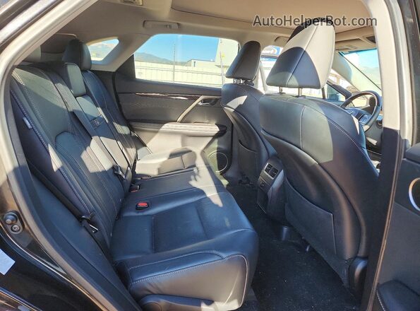 2T2BZMCAXGC041371 2016 LEXUS RX Black Rear seats view