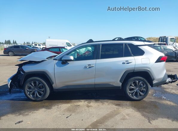 2T3B6RFV1RW059663 2024 TOYOTA RAV4 HYBRID Silver Вид задньої частини салону