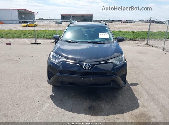 2T3BFREV2GW418808 2016 TOYOTA LE Black Vista interior trasera