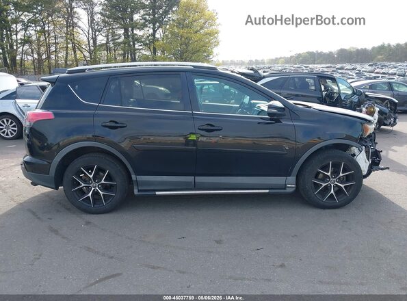2T3JFREV7GW516907 2016 TOYOTA RAV4 Black Rear interior view