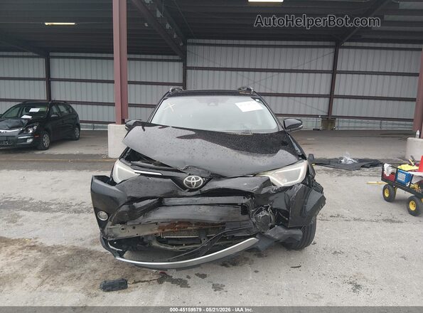 2T3RFREV2JW779042 2018 TOYOTA RAV4 Black Вид задньої частини салону
