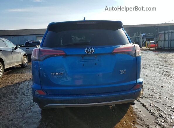 2T3RFREV3JW797968 2018 TOYOTA RAV4 Blue Rear view