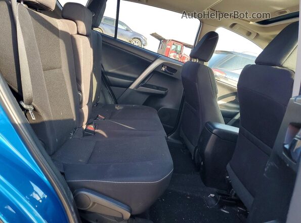 2T3RFREV3JW797968 2018 TOYOTA RAV4 Blue Rear interior view