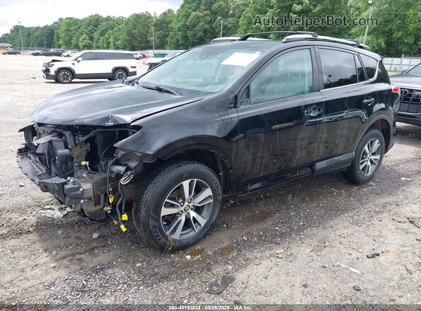 2T3RFREV3JW839345 2018 TOYOTA RAV4 Black Vista tres cuartos delantera izquierda
