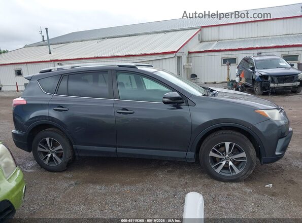 2T3RFREV9GW459824 2016 TOYOTA RAV4 Gray Vista interior trasera