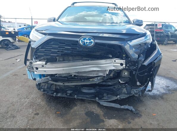 2T3T6RFV5RW071898 2024 TOYOTA RAV4 HYBRID Gray Vista interior trasera