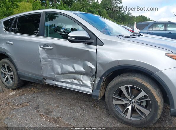 2T3WFREV7JW410695 2018 TOYOTA RAV4 Silver Front view
