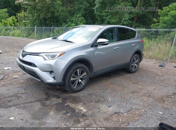 2T3WFREV7JW410695 2018 TOYOTA RAV4 Silver Front left