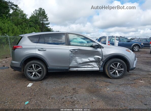 2T3WFREV7JW410695 2018 TOYOTA RAV4 Silver Rear interior view
