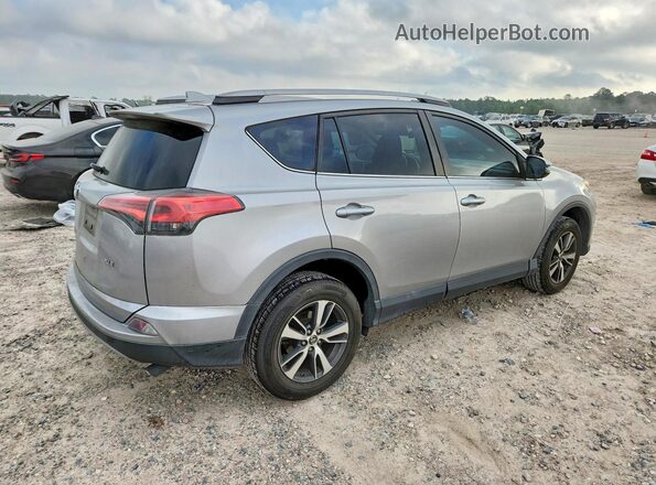 2T3WFREV7JW477099 2018 TOYOTA LE Silver Հետևի աջ