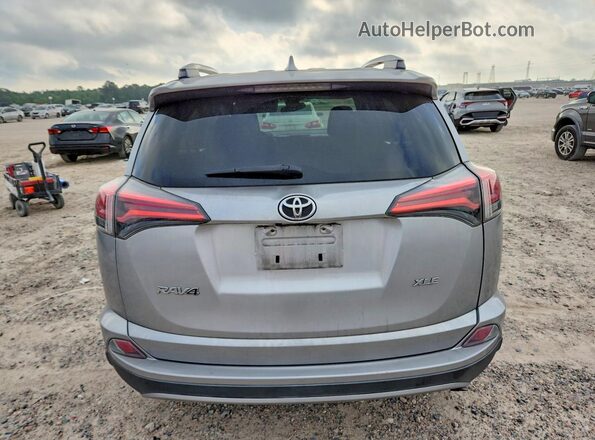 2T3WFREV7JW477099 2018 TOYOTA LE Silver Հետևի տեսք