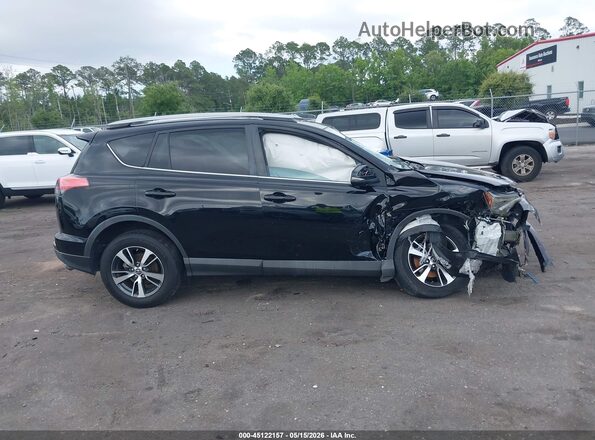 2T3WFREV8JW469948 2018 TOYOTA RAV4 Black Вид задньої частини салону