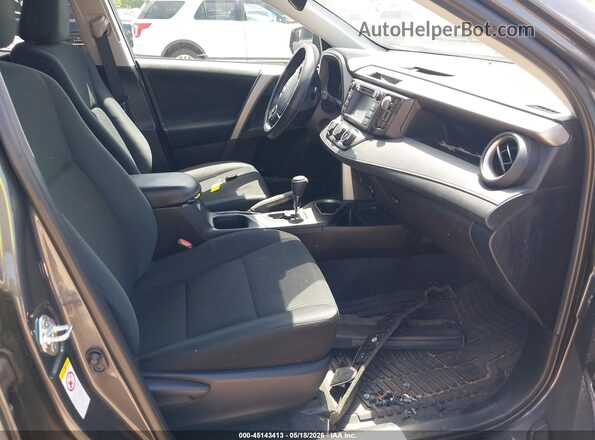 2T3ZFREV4JW450195 2018 TOYOTA RAV4 Gray Vista interior delantera
