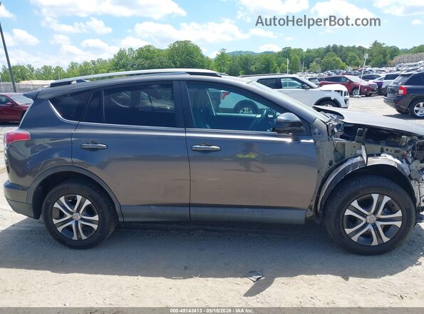 2T3ZFREV4JW450195 2018 TOYOTA RAV4 Gray Vista interior trasera