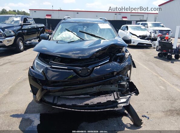 2T3ZFREV5JW495212 2018 TOYOTA LE Black Rear interior view