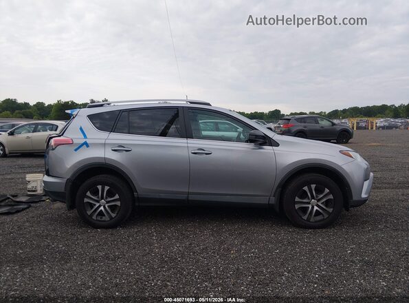 2T3ZFREV6HW335446 2017 TOYOTA LE Серебряный Вид задней части салона