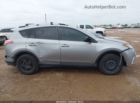 2T3ZFREV8HW352622 2017 TOYOTA RAV4 Silver Widok wnętrza z tyłu