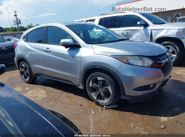 3CZRU5H57JM717058 2018 HONDA HR-V Серебряный Вид задней части салона