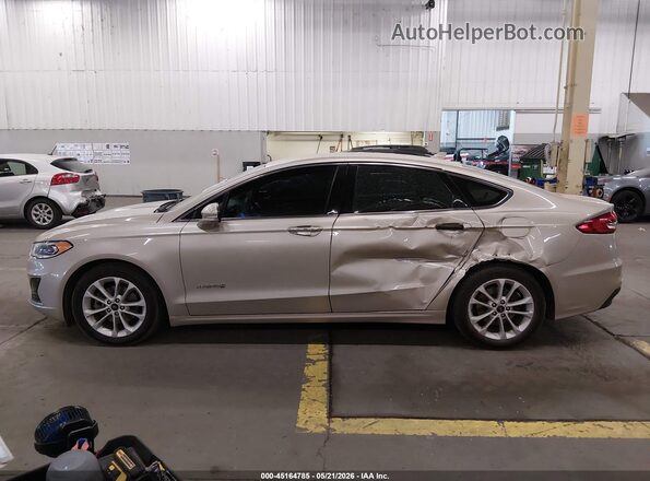 3FA6P0MU1KR235499 2019 FORD FUSION HYBRID Champagne 360 interior view
