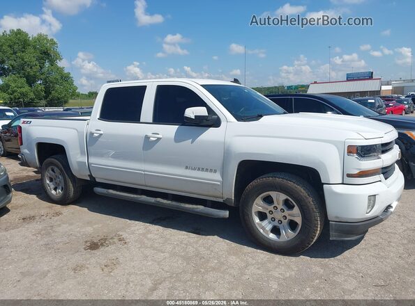 3GCUKREC4HG298580 2017 CHEVROLET SILVERADO White Widok wnętrza z tyłu