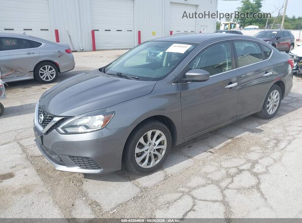 3N1AB7AP3JL627219 2018 NISSAN SENTRA Gray Vista tres cuartos delantera izquierda