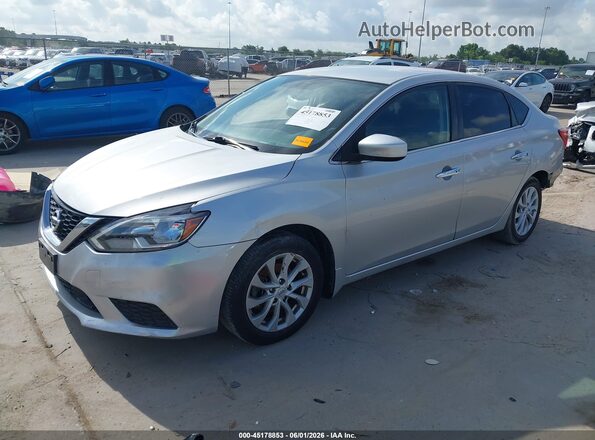 3N1AB7APXKY218414 2019 NISSAN SENTRA Серебряный Передняя левая четверть