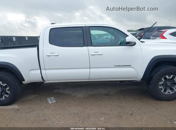3TMDZ5BN2PM157338 2023 TOYOTA TACOMA White Սալոնի հետևի տեսք