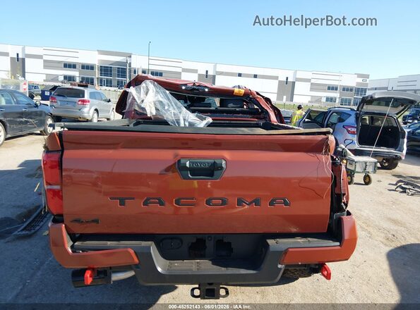 3TMLB5JN6SM099602 2025 TOYOTA TACOMA Orange Rear interior view