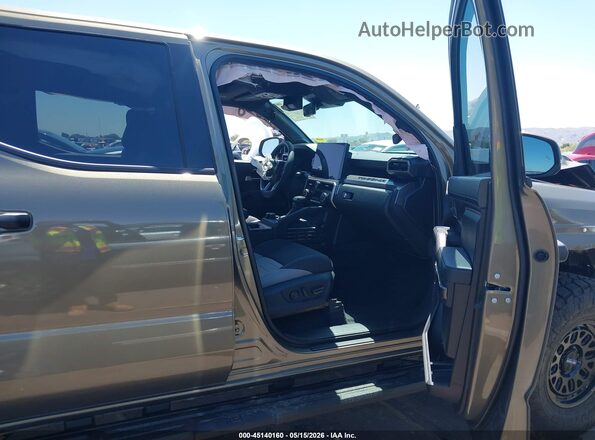 3TYLC5LN4TT060099 2026 TOYOTA TACOMA HYBRID Gold Vista interior delantera